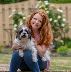 Beautiful redhead with dog