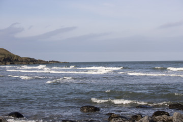 Fototapeta na wymiar Waves crashing on rocky Shore