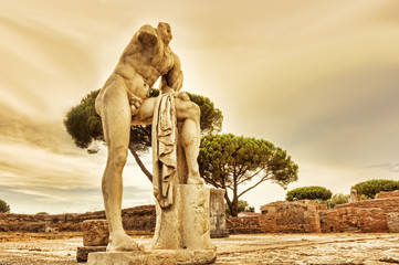 Fototapeta Archaeological excavations of Ostia Antica: The statue of Cartilius Poplicola at the temple of Hercules in Rome - Italy obraz
