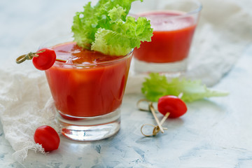 Glasses with cold tomato juice.