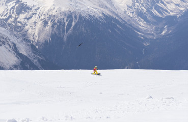 snowboarder in the mountains, the bird ,the Caucasus