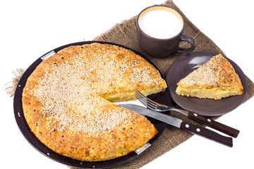 Homemade cake with cheese, sprinkled with sesame seeds