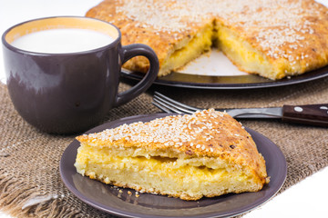 Homemade cake with cheese, sprinkled with sesame seeds