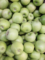 apples in a box in a store
