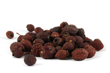Dry berries of single-seeded hawthorn (Crataegus monogyna) isolated on white.
