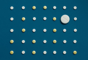 Pattern With White Tablets Blue Background, Top View. Medicine Healthcare Pharmacy Concept