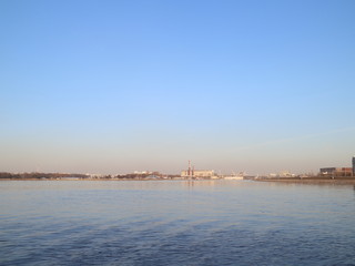 a wide river in the city in the spring evening
