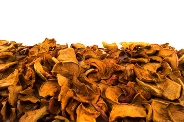 Dried apples slices spread out in the bottom half of the image on a white background.
