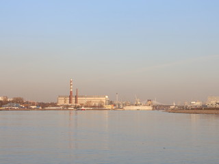 a wide river in the city in the spring evening