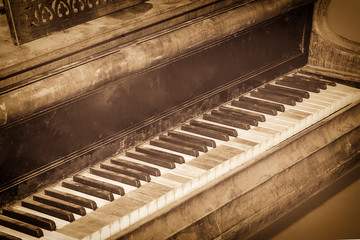 Fototapeta na wymiar Classic old grand piano, with shabby keys in vintage style