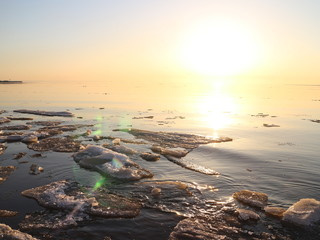Spring in the city on the shore of the bay drift ice on the river © Andrey