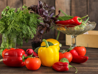 vegetables - a set of ingredients for salad (tomato, cucumber, radish, pepper, arugula, basil, parsley, dill, herbs, herbs, radish and others)