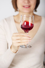 woman tasting pink wine