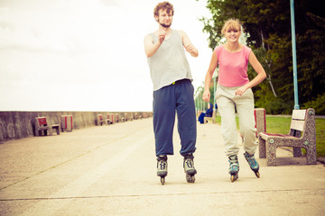 Fototapeta premium Young people casually rollblading together.
