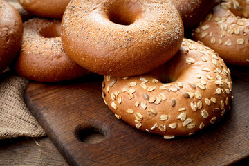 heap of bagels on wooden background