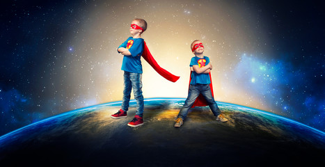 Children in superhero costumes guard the planet. © Denis