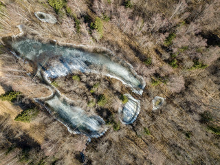 drone image. aerial view of frozen riverbank in spring, Gauja, Latvia