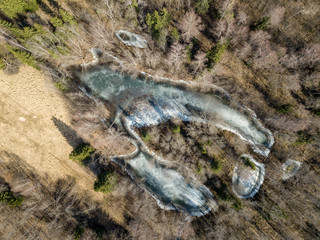 drone image. aerial view of frozen riverbank in spring, Gauja, Latvia