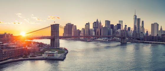 Panoramic view of Brooklyn bridge and Manhattan at sunset, New York City