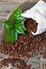 Beans roasted coffee with leaves