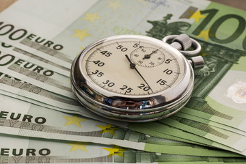 Chronometer on a bundle of bills