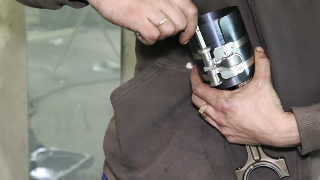 Mechanic repairs the car engine