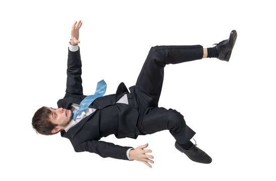 Businessman is falling down. Isolated on white background.