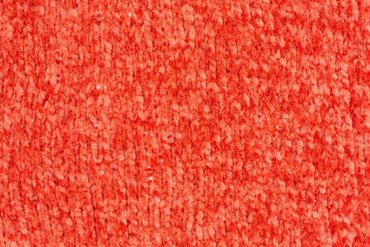 background of knitted chenille yarn in red