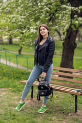 Glamorous young caucasian woman in black leather jacket