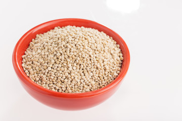 Quinoa grains in bowl isolated on white background, Chenopodium quinoa