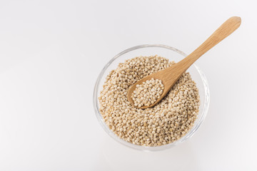 Quinoa grains in bowl isolated on white background, Chenopodium quinoa
