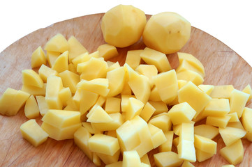 Cut potatoes into slices. Cut raw potatoes for soup. Cut fresh potatoes for cooking.
