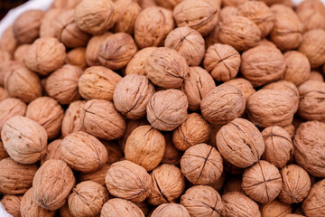 Inshell walnuts on market table