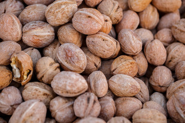 Inshell walnuts on market table
