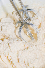 The mixing of the cream with a mixer