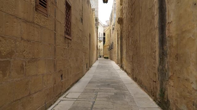 Walking along the medieval streets of old Mdina, Malta.