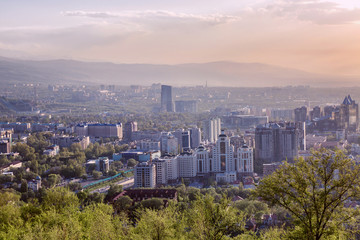 Beautiful view of the big city in the mountains at sunset