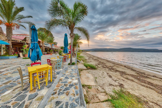 Boulevard with restaurants in coastal town in Greece
