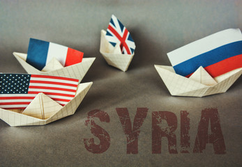 Fototapeta na wymiar paper ship with Flags of USA and Russia. conflict in Syria sea, concept shipment or free trade agreement and membership. grunge image 