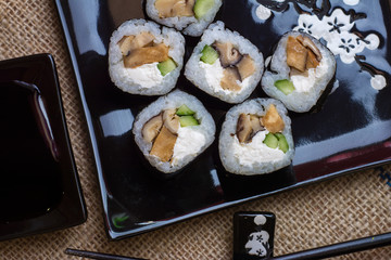 Sushi rolls  on black  table 