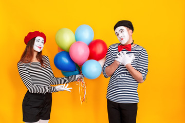 Woman present many colorful balloon his man for birthday