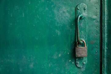 Old peeling green wooden door