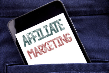 Handwriting Announcement text showing Affiliate Marketing. Business concept for Internet Online Written phone mobile phone, cellphone placed in the man front jeans pocket.