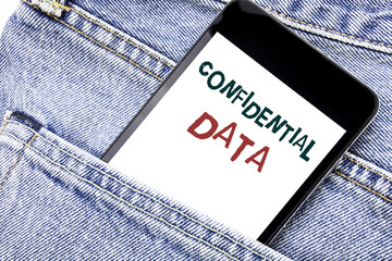 Handwriting Announcement text showing Confidential Data. Business concept for Secret Protection Written phone mobile phone, cellphone placed in the man front jeans pocket.