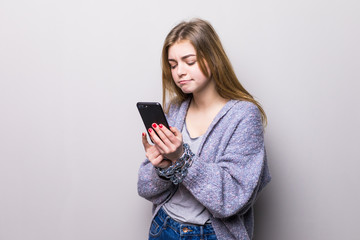 Teen Girl with chain locked hands using a smartphone isolated on white background