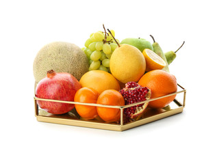 Metal tray with fresh tropical fruits on white background