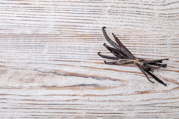 Vanilla sticks on wooden background