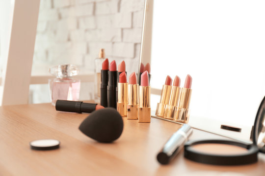 Cosmetics on dressing table in makeup room, closeup