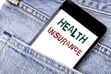 Handwriting Announcement text showing Health Insurance. Business concept for Medical Healthcare Written phone mobile phone, cellphone placed in the man front jeans pocket.