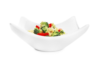 Tasty pasta salad with fresh vegetables on white background